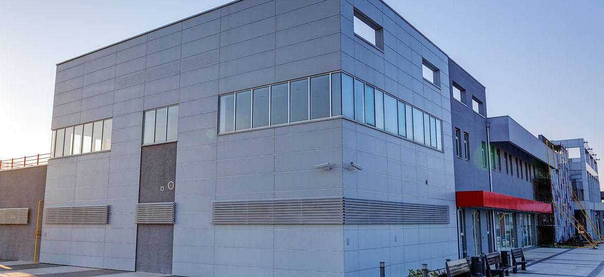 Nettoyage haute pression bardage bâtiment industriel